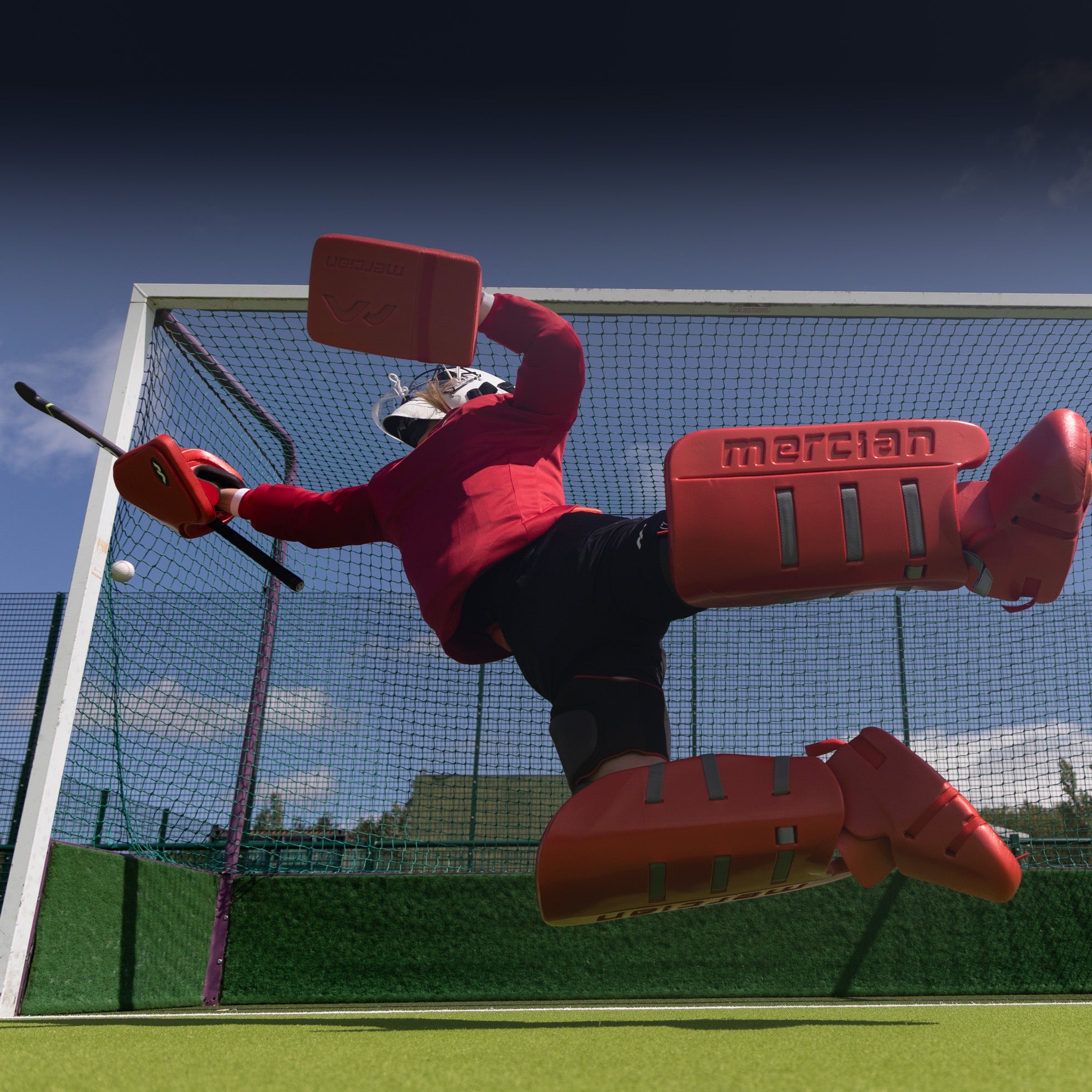 Crouched Mercian Field Hockey Goalkeeper 