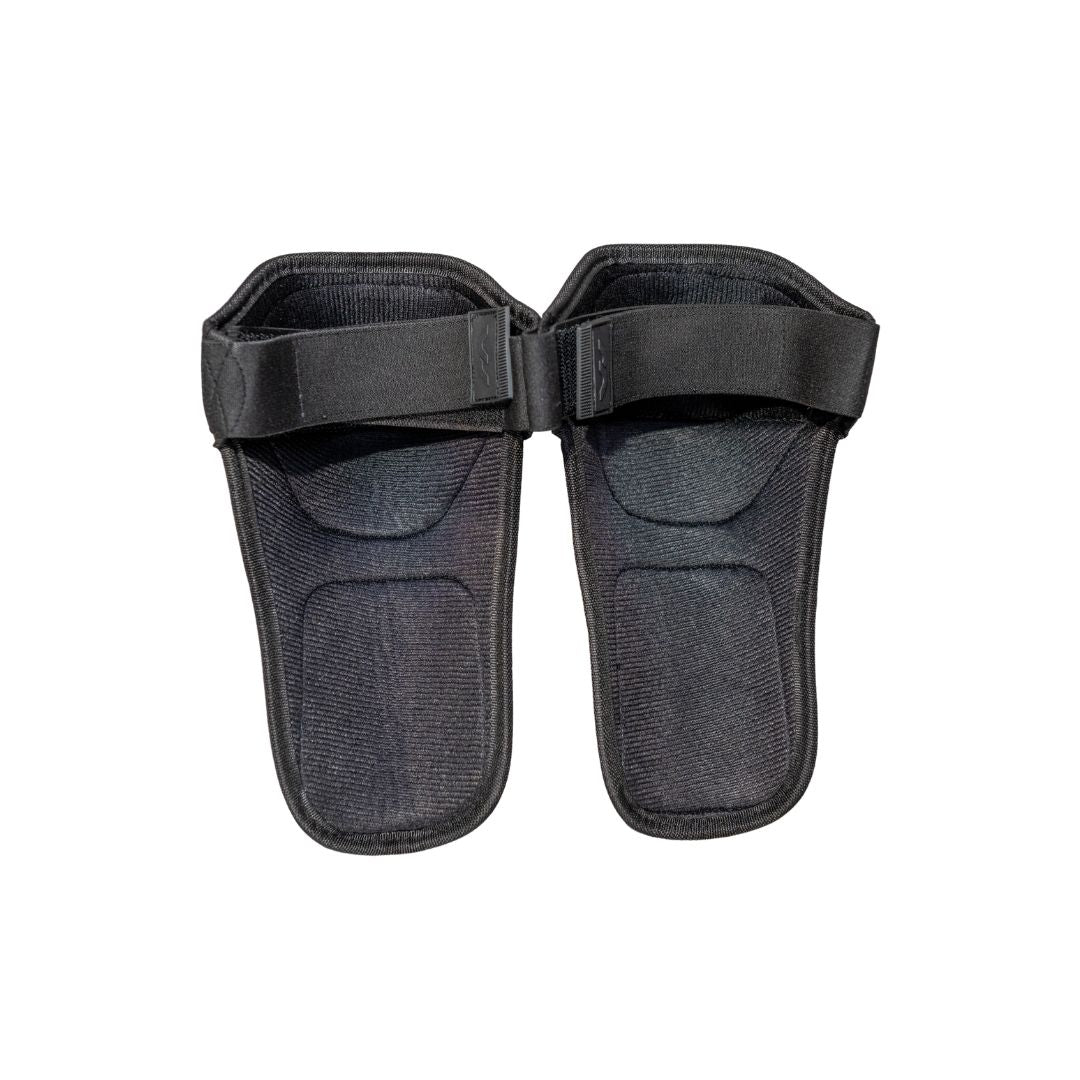 Mercian Penalty Corner Knee Pads rear view showing cushioned foam backing, adjustable elastic straps and lightweight ergonomic construction for secure comfort during defensive play.